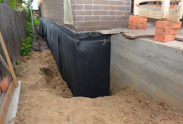 SJ Waterproofing Pros technician performing targeted Waterproofing assessment in Green Lane, PA